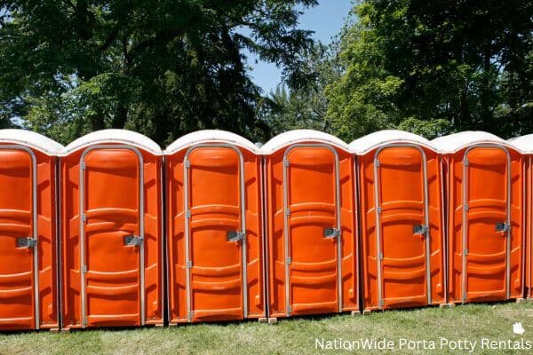 a lineup of clean and well-maintained portable loos for workers in Mize, MS