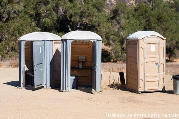 a clean row of portable restrooms for outdoor weddings or festivals in Robinsonville, MS